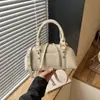 Bolsa de bolos de alta gama para mujer, nuevo bolso de moda 2026, bolso de hombro, bolso cruzado, bolso tipo almohada, bolso retro de nicho tipo concha