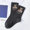 Calcetines de moda de Dongdaemun, estilo más vendido, calcetines de media pantorrilla para mujer con oso brillante, calcetines deportivos largos de alta elasticidad, calcetines de algodón