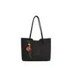 Bolso de hombro y mano de gran capacidad, elegante, sencillo y de alta gama para el día a día con colgantes, nuevo bolso de mano tote para mujer de otoño 2026