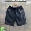 Nuevos Shorts Casuales Transpirables Perforados con Láser para Hombre, Moda Simple, Combinan con Todo, Holgados, Secado Rápido, Pantalones de Seda de Hielo