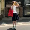 Saia Feminina Azul Marinho Estilo Japonês, Novo Modelo Primavera e Outono 2026, Saia Curta Casual Soltinha Emagrecedora para Figuras Baixas, Cintura Elástica Esportiva
