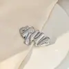 Europeu e Americano criativo anjinho girassol broche simples suave doce plissado águia aço inoxidável roupas pin