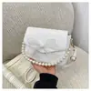 Bolsa Pequena de Corrente de Pérolas para Mulheres 2025 Nova Tendência Moda Casual Texturizada Laço Ombro Transversal