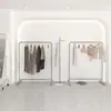 Colgadores de tienda de ropa acero inoxidable plata cepillada estantes de exhibición de tiendas de mujeres en el estante central escaparate piso