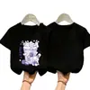 Camiseta Casual Estilosa de Verão com Manga Curta para Meninas 2026 Novo Estilo Estampa de Desenho Animado Algodão Puro para Crianças Maiores