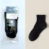 Calcetines de empaque individual para hombre, calcetines de algodón para hombre de color liso para otoño e invierno, calcetines para hombre al por mayor, calcetines deportivos de tubo largo para hombre