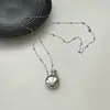 Colgante de botella de perfume petaca de plata collar largo diseño de nicho femenino cadena de cuentas cadena de suéter accesorios de alta gama