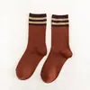 Calcetines para mujer otoño e invierno explosiones algodón apilado calcetines japoneses dos rayas retro tubo largo moda calcetines para mujer estilo académico calcetines al por mayor