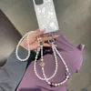Verano Lujo Ligero Morado Láser Colorido Cuentas Heidi Cadena para Teléfono Móvil Colgante de Muñeca Portátil Anti-pérdida Cadena para Funda de Teléfono Móvil Creativa