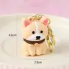 Llavero de Perrito Lindo al por Mayor Colgante Creativo de Perro Mascota de Dibujos Animados Figura Mini de Goma Suave Encanto para Mochila Personalizado