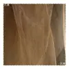 Color camello amarillo ligeramente moteado retro desgastado fino transparente textura de malla tela de organza teñido anudado falda tela para ropa