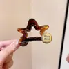 Grampo Estrela de Cinco Pontas Padrão Ouro Coreano para Mulheres 2025 Novo Clipe de Tubarão Elegante de Alta Qualidade Acessórios de Cabelo de Luxo Acessível Versáteis
