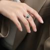 Anillo de pareja anillo de Möbius anillo abierto hueco acero de titanio oro de 18K anillo de temperamento nicho que no se desvanece para mujer