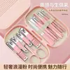 Set de manicura portátil, 14 piezas, con esquinas redondeadas y una caja cuadrada, incluyendo cortaúñas, tijeras para uñas y limas de uñas, un set elegante y práctico para uso doméstico