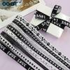 Cinturón de poliéster estampado en blanco y negro directo de fábrica, regalo para mascotas, cinta DIY, cinta con huellas de cachorro, cinturón forjado