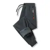 Calça Casual de Lã de Cordeiro Nova Transfronteiriça para Homens no Outono e Inverno, Calça Casual Tendência Solta Tamanho Grande com Forro de Veludo, Calça de Moletom Fria e Quente