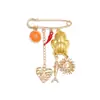 Broches divertidos de estilo europeo y americano, los más vendidos a nivel transfronterizo: broches de aleación con colgantes de sol, corazón, pez, naranja que gotea aceite, chile al por mayor