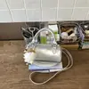 Bolsos de nicho populares transfronterizos 2026 modelo nuevo de primavera bolso de hombro simple versátil bolso cruzado casual bolso cilíndrico