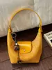 Bolsa de axila feminina transfronteiriça 2026 nova bolsa de bolinho, bolsa de ombro de nicho de luxo leve de alta qualidade, bolsa transversal para o dia a dia