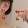 Aretes de Bola de Pelo con Lazo Rojo Ankora para Nochevieja, Exquisitos Retro, Simples, de Gama Alta y Versátiles, Pendientes Elegantes