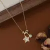 Corrente Elegante para Clavícula Banhada a Ouro Real com Zircônia Micro-Incustada para Mulheres, Colar Estrela de Cinco Pontas em Concha Natural de Design de Nicho Atacado