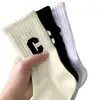 Meias Letra C Femininas Meia-Perna Outono e Inverno Quentes Modernas Celebridade da Internet Roupa Infravermelha Meias de Cano Alto Meias Esportivas Versáteis