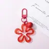 Llavero con hebilla de flor hueca transparente fresca y colorida, accesorio de campana, colgante para bolso, venta al por mayor