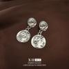 Europa y Estados Unidos viento frío raya geométrica redonda metal pendientes moda mujer simple temperamento pendientes fabricantes pendientes al por mayor