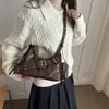 Tendencia transfronteriza estilo coreano bolso de mano tipo dumpling para mujer 2026 otoño nuevo color sólido empalme bolso de hombro único para ir al trabajo bolso cruzado