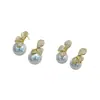 Pendientes de botón y colgantes de flor de trébol y perla de alta gama, elegantes, a la moda, de lujo ligero, con detalles completos de diamantes, venta al por mayor de pendientes de alta gama