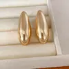 Aretes de botón ovalados lisos de aguja plateada, estilo metálico fresco minimalista, aretes únicos de nicho, conjunto de joyería de lujo ligero de alta gama