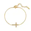 Pulsera de cruz de lujo ligero coreana y japonesa con diamantes completos para mujer, diseño de nicho con un toque minimalista de alta gama, nuevo modelo 2026, versátil para ir al trabajo