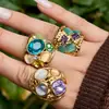 Anillo Misterioso Retro Estilo Palacio Hueco de Acero Inoxidable con Piedra Ojo de Gato de Oro de 18 Quilates y Piedra de Cristal, Anillo de Nicho de Lujo Ligero para Mujer