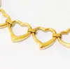 Novo Bracelete Coração Estilo T com Coração de Pêssego Gravado, Bracelete de Aço Titânio com Cinco Anéis, Galvanizado, Popular nas Redes Sociais, Atacado para Comércio Exterior