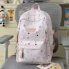 Mochila linda de niña con estrellas estampadas por todas partes, adecuada para estudiantes de secundaria y preparatoria, elegante y ligera