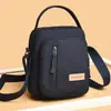 Bolso de hombro y cruzado para mujer de lona de nailon nuevo, bolso pequeño moderno y versátil, bolso para teléfono portátil multicapa, bolso de mano simple