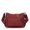 Bolso tote de nailon con múltiples compartimentos para mujeres de mediana edad y mayores, nuevo estilo 2025, moderno, gran capacidad, bolso de hombro versátil