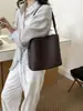 Bolso cruzado de patrón tejido casual, bolso de hombro de nicho retro de lujo ligero, bolso versátil de cuero suave de alta gama para madre e hija