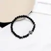 Mais Vendido Internacionalmente na Amazon 6mm Contas de Pedra Natural Pedra Negra Pulseira de Cruz Pulseiras Elásticas para Homens e Mulheres