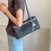 Bolso Nuevo para Viajar Mujer Retro 2026 Baguette Otoño Versátil Gran Capacidad Debajo del Brazo Hombro Único Sencillo de Mano Mezclilla