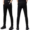 Jeans negros puros de alta gama Hong Kong 2026, elásticos, corte slim para hombre, pantalones casuales versátiles estilo coreano