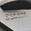 Stock de fábrica moda europea y americana 316L acero titanio inoxidable aro para oreja con garra redonda y taladro redondo juego de 6 piezas decoración al por mayor