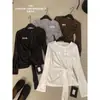 ULOUR/U grano nuevo de principios de otoño estilo coreano versátil para el día a día y el trabajo hebilla de nudo de copo de nieve camiseta de manga larga 75808