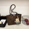 Bolso Cubo Portátil de Contraste de Color Retro Francés Transfronterizo Nuevo para Mujer Otoño e Invierno Versátil para el Trabajo y los Viajes Bolso Cruzado