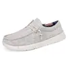 Nuevos zapatos de caminar de gran tamaño para hombre con punta ancha, mocasines sin cordones, zapatos de lona ligeros y cómodos en blanco y negro