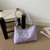 La popular bolsa de mano para dumplings de estilo fresco de este año para mujer, nuevo modelo de otoño 2026, elegante bolso de hombro con lazo, bolso de moda para el antebrazo