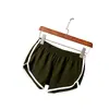 2024 Shorts esportivos europeus e americanos femininos, casa casual, cor sólida, moda ioga, praia, calças esportivas de cor doce