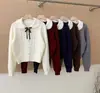 Cardigã de tricô com gola Peter Pan e laço estilo college para mulheres, jaqueta suéter versátil estilo coreano para outono/inverno, top curto