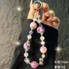 Colgante para Teléfono de Bola de Pelo Estampado de Leopardo Cadena de Cristales Hecha a Mano Correa de Muñeca Llavero Colgante de Bolso Otoño e Invierno Venta al por Mayor