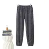 Nuevos estilos de otoño e invierno: Pantalones jogger de cuadros para mujer, cálidos, forrados de polar, de tiro alto, adecuados para madres de mediana edad, y se pueden usar como ropa exterior
